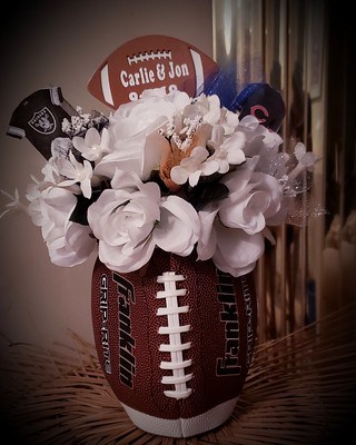 Football centerpiece with flowers.