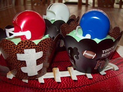 Football helmet decorated cupcakes.