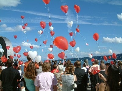 A balloon release of heart shaped balloons.