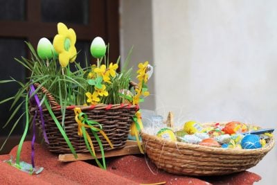 Easter basket with treats and flowers.