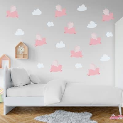Flying pigs wall decal in a bed room.