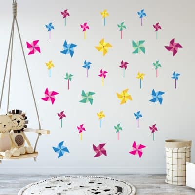 Colorful pinwheel wall decals in child's play room.