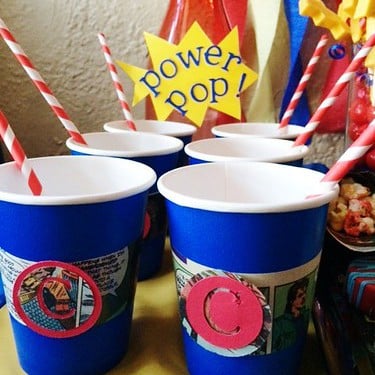 Comic book cups at a comic party.