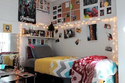 Dorm room with a photo wall.
