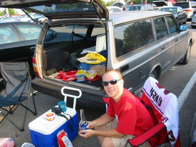 A guy tailgating at a football game.