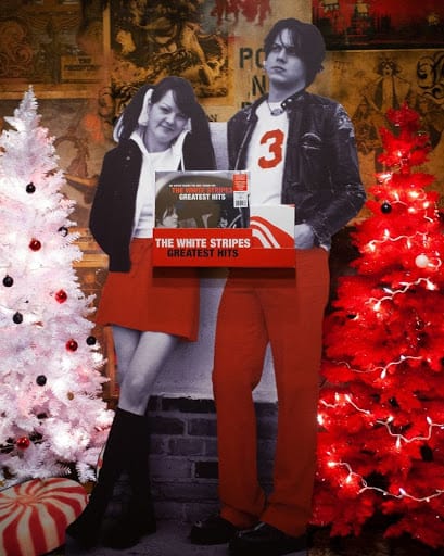 Point of purchase display of The White Stripes by Christmas trees.