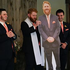 A cutout of the groom's brother at a wedding.
