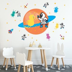 Alien Astronaut Party wall decal displayed on playroom wall.