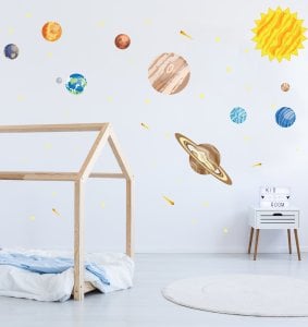 Solar System wall decal arranged on playroom wall.